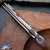 Skiff Made Blades Fugitive, Damasteel (Fafnir Pattern) Blade, Milled Titanium Scales, Ti Backspacer, Zircuti Pivot Collar and Clip #099