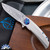 Skiff Made Blades Fugitive, Damasteel (Fafnir Pattern) Blade, Milled Titanium Scales, Royal Blue Ti Backspacer, Black Timascus Pivot Collar and Clip,  #100