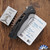 Dead Reckon Knives RB-4462-17 Ridgeback Integral Vertebrae, Stonewashed Reverse Tanto S45VN Blade, Black Aluminum Handle, Orange Lug