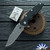 Hinderer 3.5″ Eklipse Skinny Fullered Harpoon Spearpoint, Working Finish Magnacut Blade, Black G10 Scale, Battle Bronze Titanium Frame