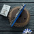 Hinderer 3.5″ Eklipse Skinny Fullered Harpoon Spearpoint, Working Finish Magnacut Blade, Blue G10 Scale, Working Finish Titanium Frame