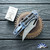 John Gray Slitter V2, Dark Rain Magnacut Bowie Blade, Copper Flake Carbon Fiber Scale And Blue/ Bronze Titanium Clip And FrameLock Lockside W/ Blue HW