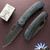 WE Knife Co Inmate Front Flipper, Blackwashed CPM-20CV Blade, Black Titanium Handle W/Blue Raindrops