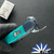 BURN Custom Trapdoor D/A OTF, Hand Rubbed Satin 154cm Bayonet Blade, Ice Blue Anodized Bolsters, Aqua Giraffe Bone Handle Scales