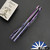 John Gray Slitter V2, Dark Rain Magnacut Harpoon Bowie Blade, Purple/ Blue Chain-link Pattern Titanium Handle With Matching Clip And Blue HW