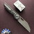 Hypercut Manufacturing Cretin, Dark Stonewashed S45VN Blade, Carbon Fiber Handle Scales W/Zirc Pivot And Black Timascus Pivot Collars