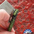 Heretic Knives/Maverick Customs Collaboration Scribe Flipper Pen,  Black W/ Green Splatter
