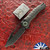 Heretic Knives X John Gray Custom Wraith V4 Manual, Hand Ground Black Tanto Blade, Barked Titanium Chassis W/ Green Anodized Titanium Pivot Collar