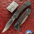 Buck Model 110 Hunter Crossbar, Magnacut Blade, DymaLux Macassar Ebony Inlays And Cobalt Cerakoted Aluminum Bolsters