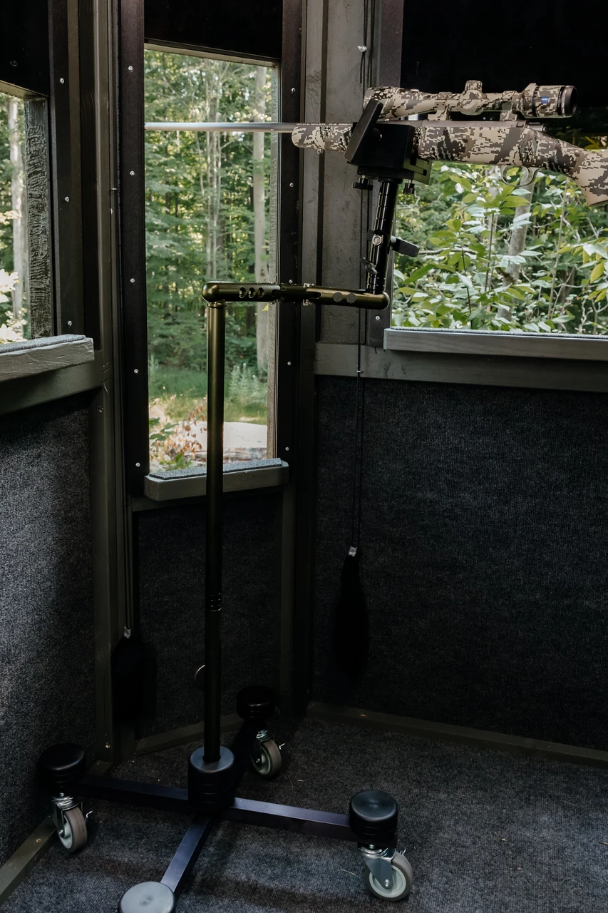Shooter zeroing a rifle using the XtraArm Roller Rest at an outdoor range