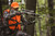 Branch Out rest on climbing treestand in wooded setting, rifle hunting use