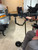 XtraArm shooting rest mounted to Action Track Stander mobility device