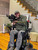 Permobil M series chair with XtraArm rest attached, adaptive shooting setup