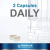 Two capsules beside a glass of water, 2 capsules daily