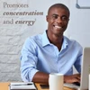 Smiling man working at a laptop, promotes concentration and energy graphic