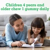 Mother and daughter reading, children 4 years and older chew 1 gummy daily