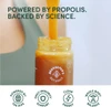 Honey pouring into a jar, powered by propolis graphic
