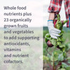 Gardener holding fresh beets, whole food nutrients plus 23 organically grown fruits and vegetables