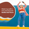 Woman holding a shaker, shake it up with new and improved Vanilla Chai flavor