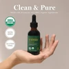 Hand holding Turmeric bottle, clean & pure organic, non-GMO and gluten-free graphic