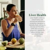 Woman drinking juice in a kitchen, Liver Health description
