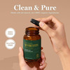 Hand opening the bottle, clean and pure graphic with GMO-free and gluten-free badges