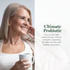 Smiling woman holding a mug with Ultimate Probiotic text