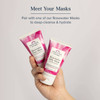 Hand holding two Heritage Store Rosewater masks, pair with a mask to deep-cleanse and hydrate
