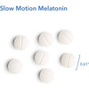 Slow Motion Melatonin tablets beside a 0.61 inch size marker