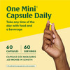 Hand holding a mini capsule, one mini capsule daily, 60 capsules, 0.62 in length
