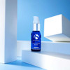 iS Clinical Poly-Vitamin Serum on white blocks against a blue sky