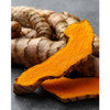 Fresh turmeric root, whole and sliced