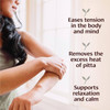 Woman massaging her arm with Pitta Massage Oil, benefits graphic
