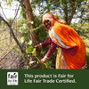 Woman harvesting leaves, this product is Fair for Life Fair Trade Certified