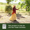 Woman carrying harvested herbs in a field, Fair for Life Fair Trade Certified graphic