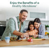 Family preparing a meal together in a bright kitchen lifestyle photo