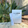 nanoLEAN box and stick packet outdoors on a rock