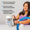 Woman blending a shake beside the tub, mix two scoops with your favorite liquid