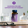 Bold Vision bottle beside eyeglasses and a water glass, eye nourishment graphic