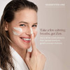 Woman applying face cream, suggested use dime-sized amount graphic