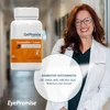 Eye doctor in a white coat beside the bottle