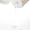 Clear Oligomer Well-Being shower gel droplet from the tube flip-top cap