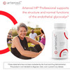 Smiling woman outdoors beside the Arterosil HP bottle