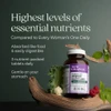 Women's Advanced bottle on driftwood with fruit and greens, highest levels of essential nutrients graphic