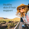 Woman in convertible with sun hat, healthy skin and hair support lifestyle graphic