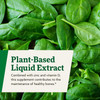 Fresh spinach leaves, plant-based liquid extract with zinc and vitamin D for bones