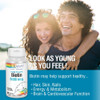 Couple outdoors with Biotin bottle, look as young as you feel hair skin nails graphic