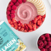 Collagen Building tub beside a smoothie bowl with raspberries and banana