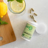 Probiotics bottle with capsules lemon and lemon water marble flat lay graphic