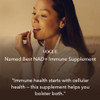 Woman taking a capsule, Vogue named best NAD+ immune supplement quote
